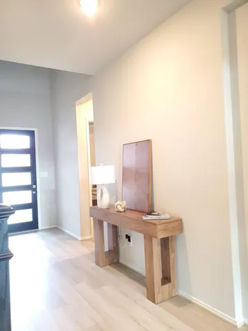 a view of a kitchen with kitchen island stainless steel appliances a sink stove and window