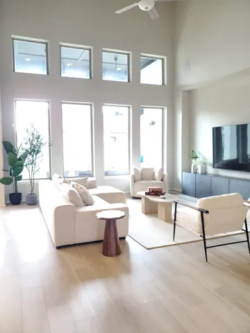 a living room with furniture and a large window