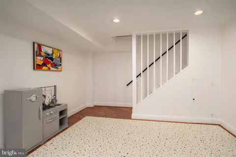 a bed room with furniture and a flat screen tv