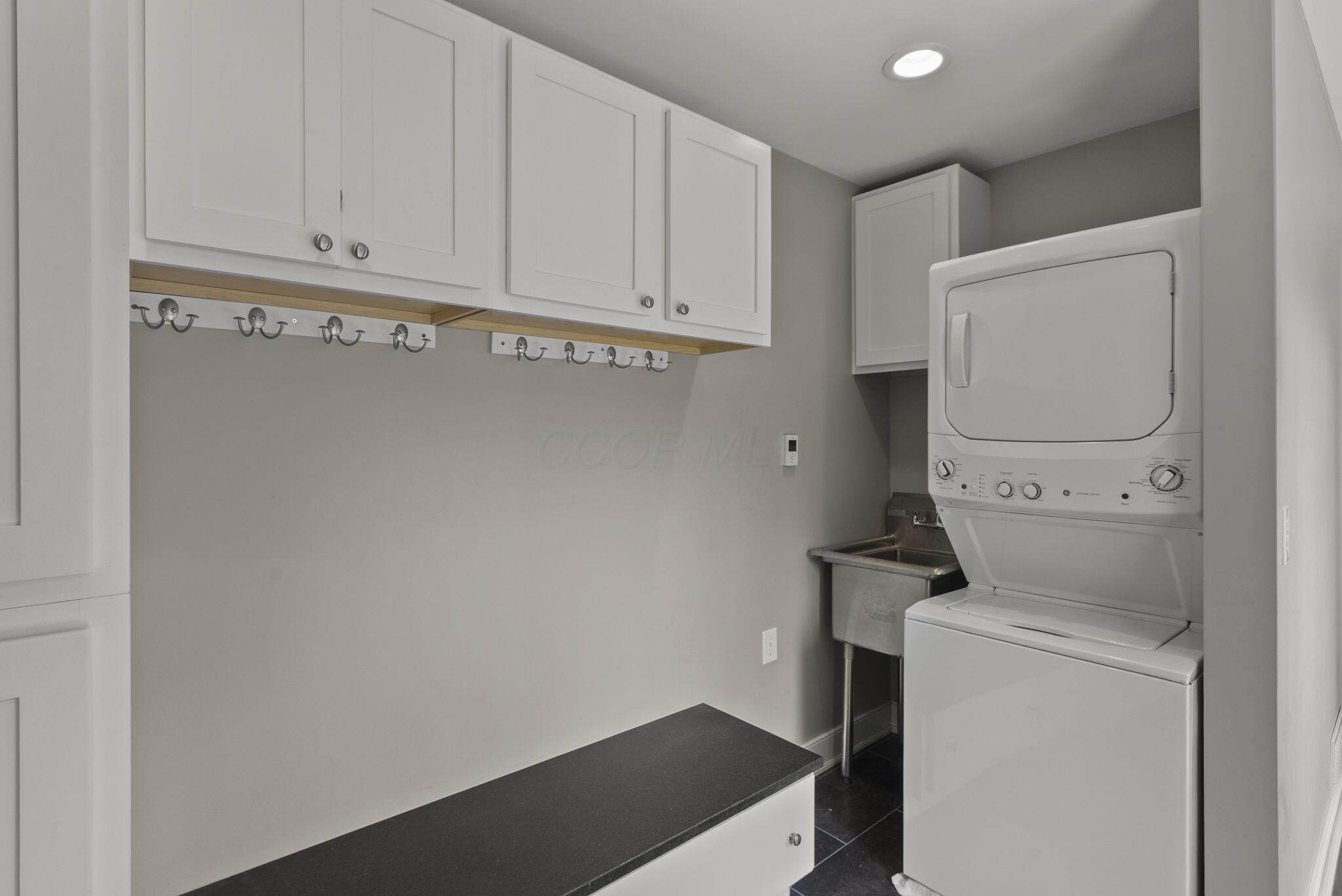 1851 Berkshire Road Columbus, OH 43221 - Photo 68 of 125 Utility space, drop zone, mud room, providing storage and easily accessible laundry.