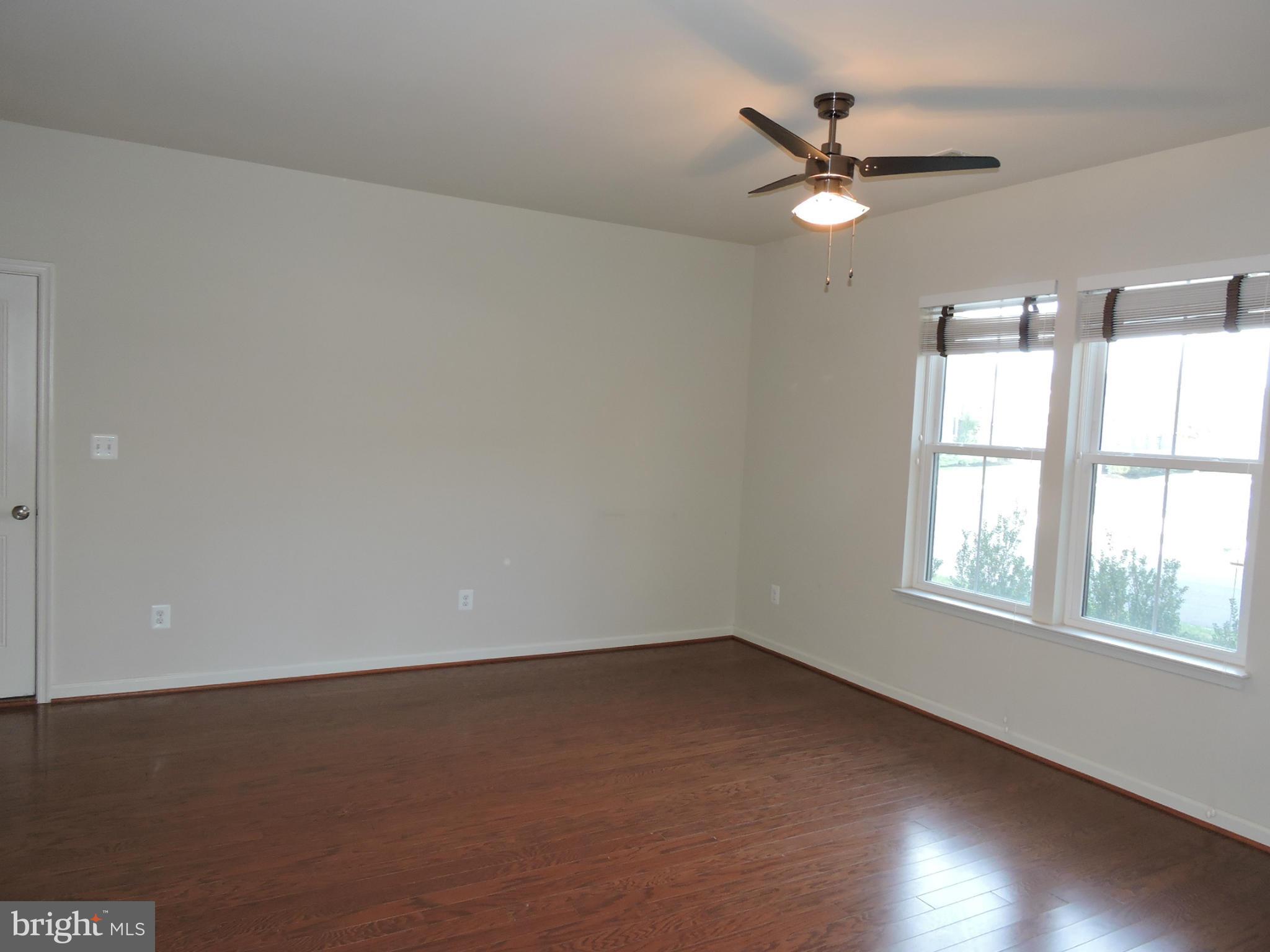 20425 Codman Drive Ashburn, VA 20147 - Photo 11 of 36 an empty room with a window and a fan