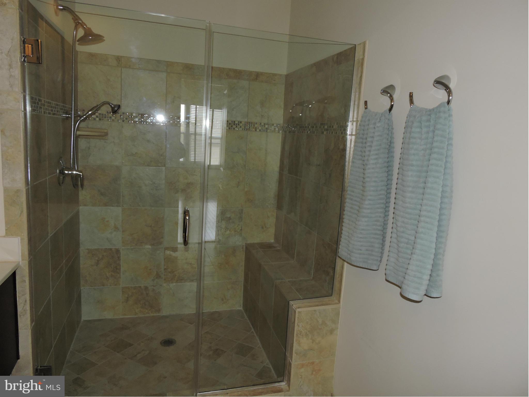 20425 Codman Drive Ashburn, VA 20147 - Photo 14 of 36 a bathroom with a shower