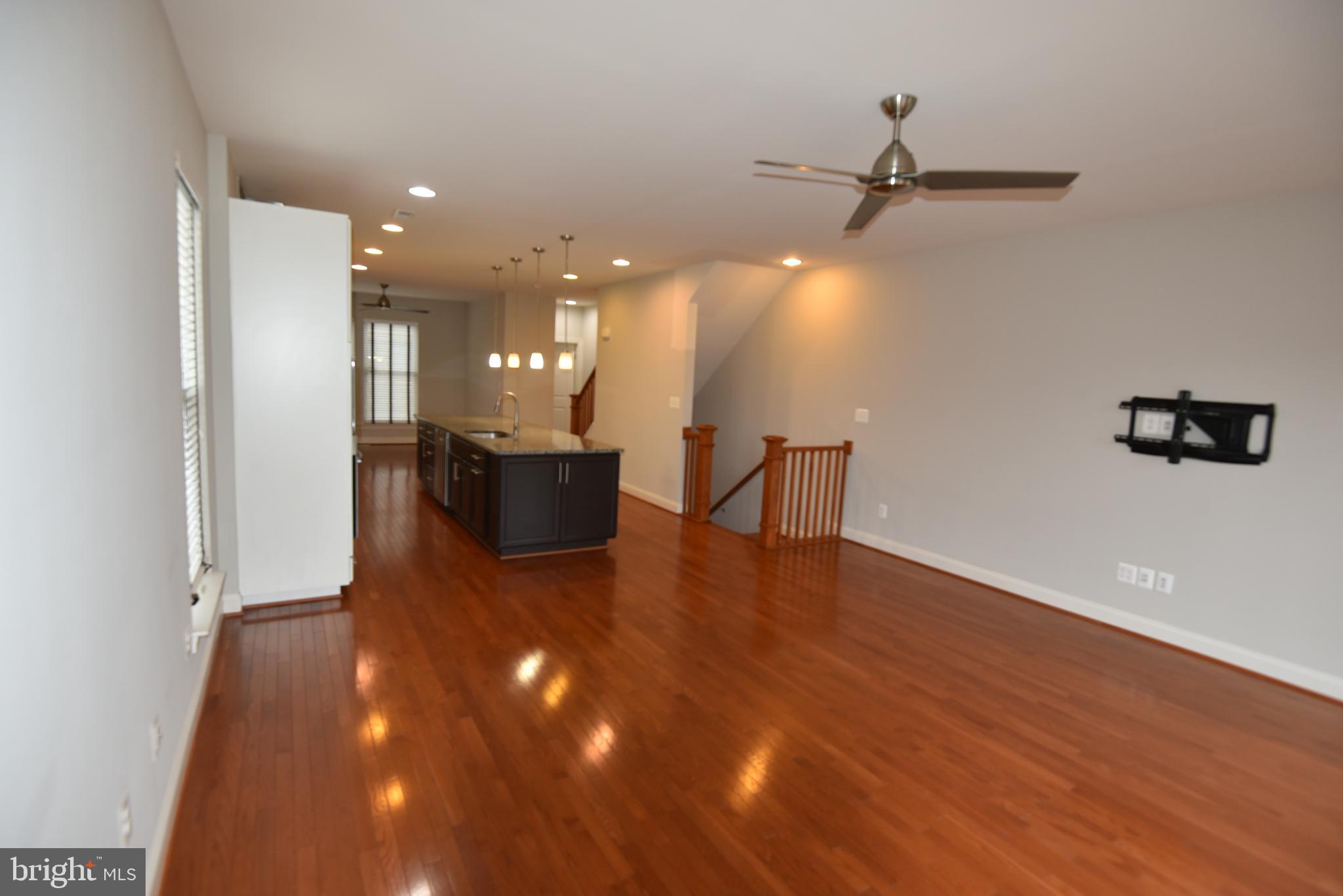 20425 Codman Drive Ashburn, VA 20147 - Photo 24 of 36 a view of a livingroom with furniture and wooden floor