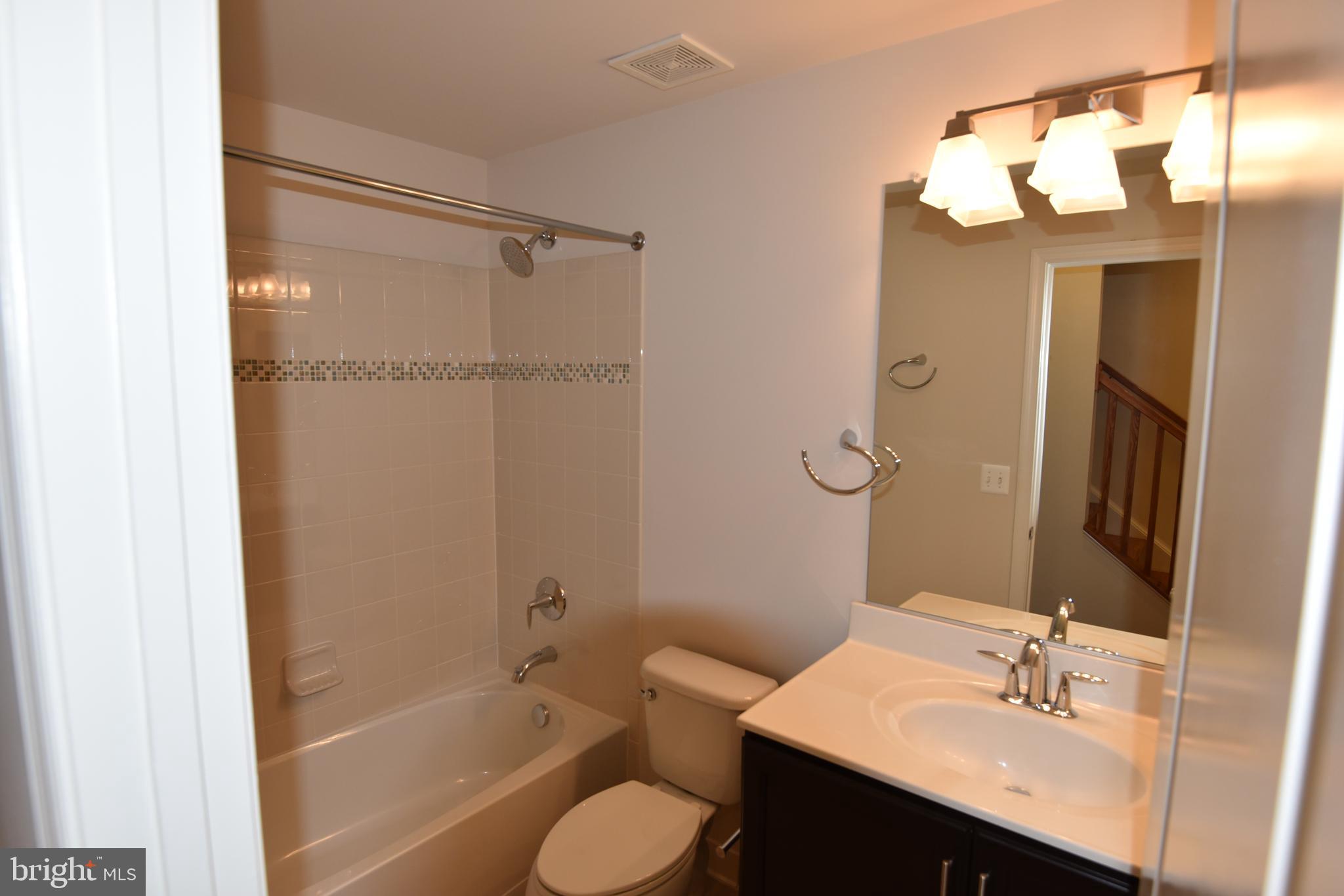 20425 Codman Drive Ashburn, VA 20147 - Photo 29 of 36 a bathroom with a sink toilet and shower