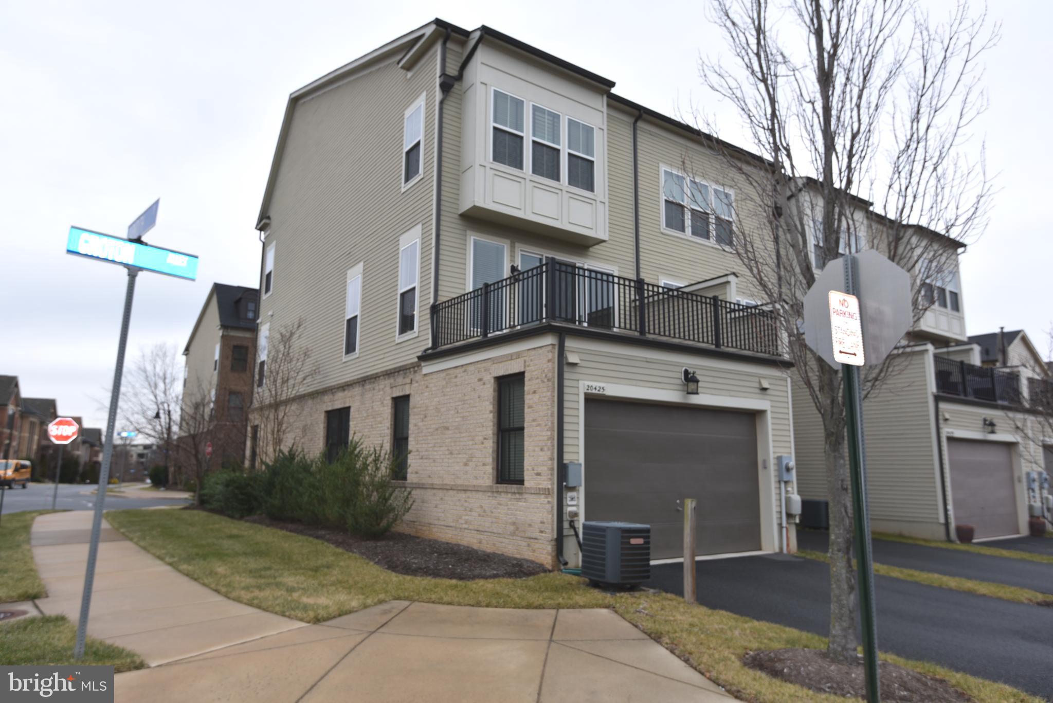 20425 Codman Drive Ashburn, VA 20147 - Photo 34 of 36 a front view of a building with a garden