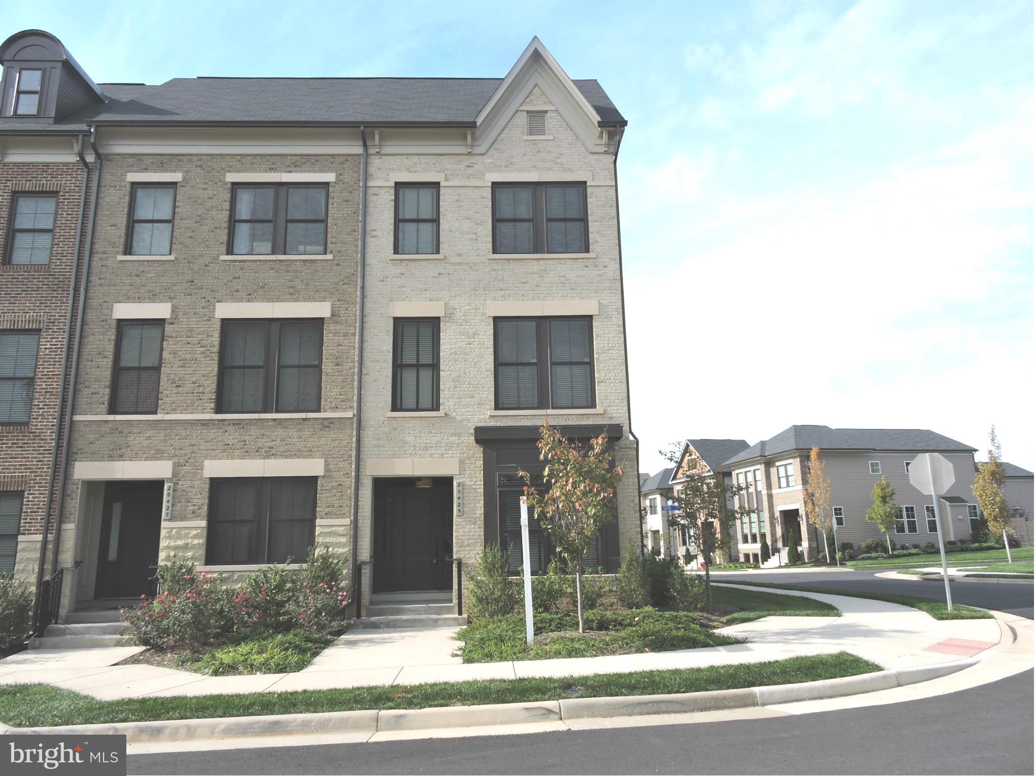 20425 Codman Drive Ashburn, VA 20147 - Photo 35 of 36 a front view of a house with a yard