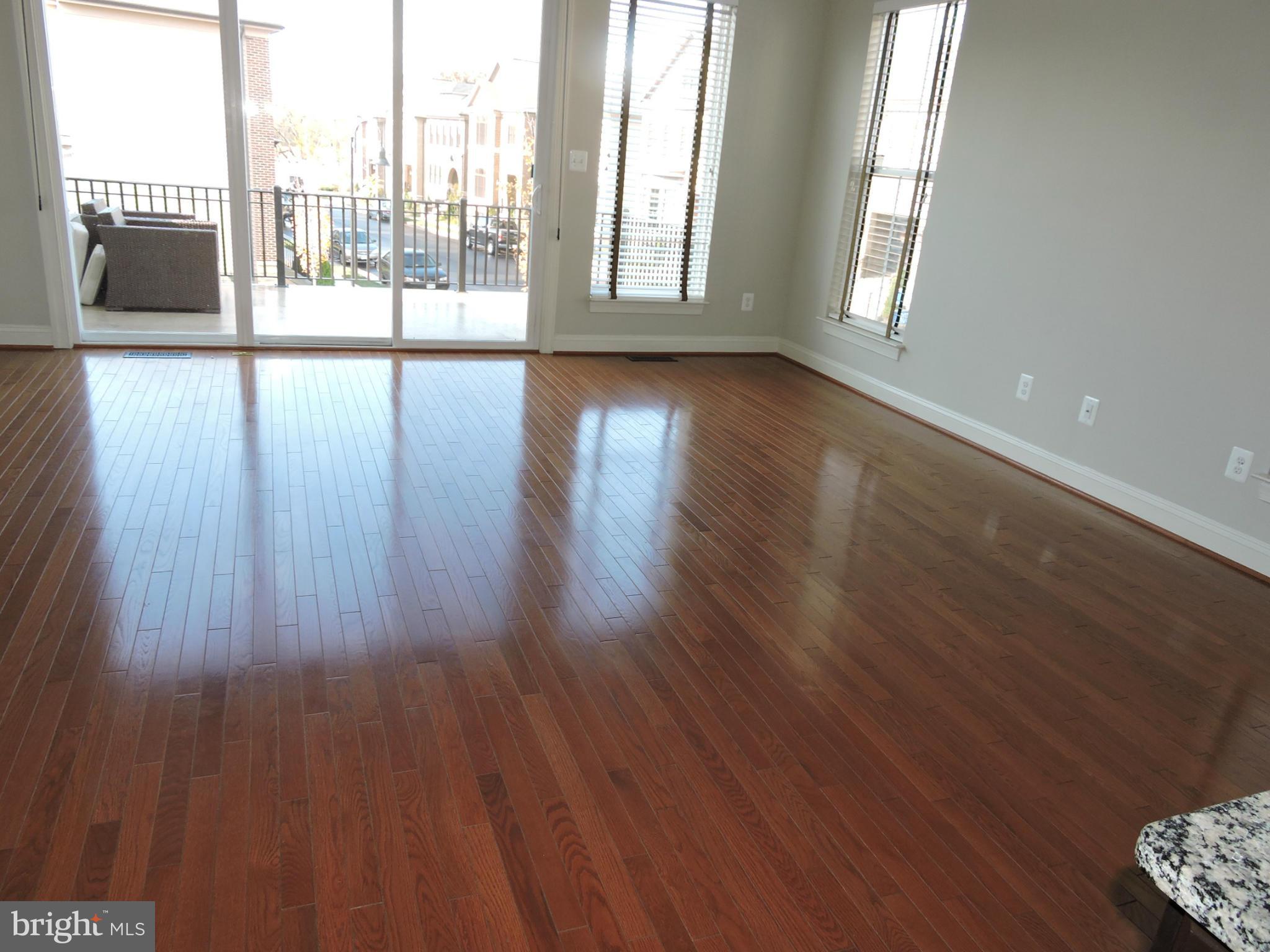 20425 Codman Drive Ashburn, VA 20147 - Photo 8 of 36 a view of an empty room with wooden floor and a window