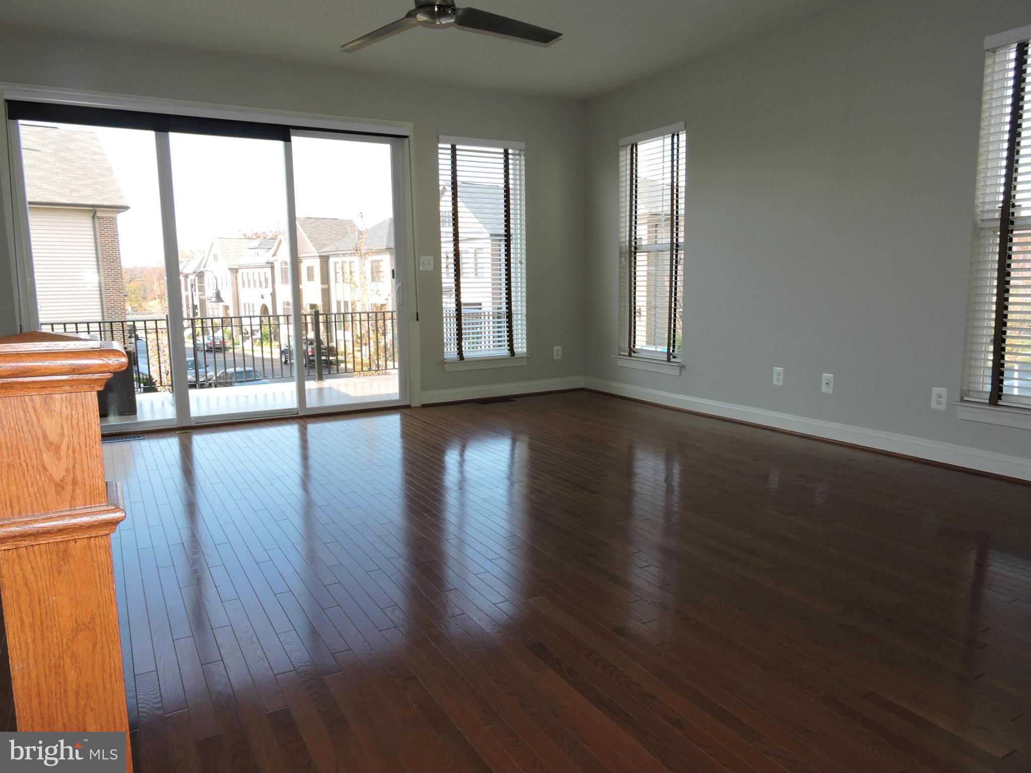20425 Codman Drive Ashburn, VA 20147 - Photo 9 of 36 a view of an empty room with wooden floor and a window