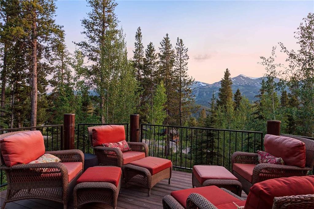 56 Rounds Road Breckenridge, CO 80424 - Photo 16 of 35 a wooden deck with outdoor seating and trees