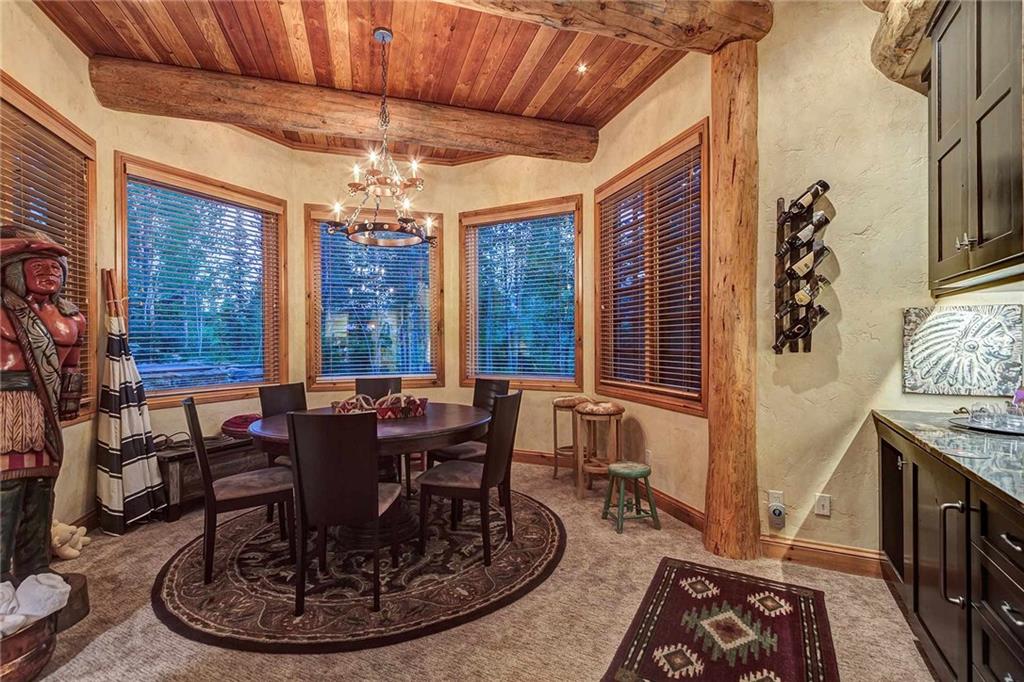 56 Rounds Road Breckenridge, CO 80424 - Photo 27 of 35 a dining room with furniture a chandelier and wooden floor