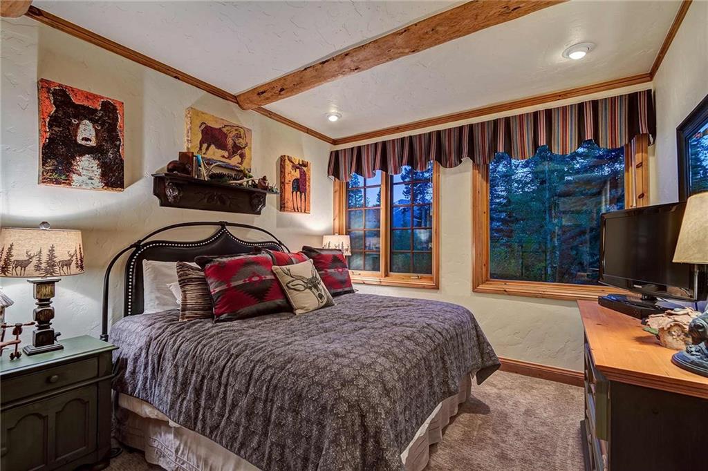 56 Rounds Road Breckenridge, CO 80424 - Photo 30 of 35 a bedroom with a large bed and a flat tv screen