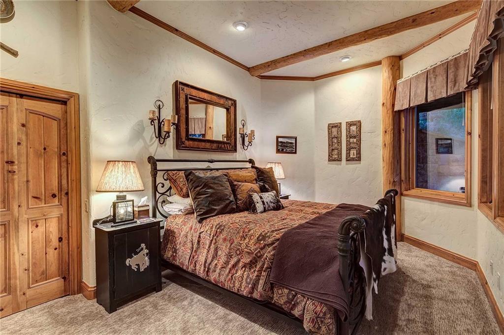 56 Rounds Road Breckenridge, CO 80424 - Photo 33 of 35 a bedroom with a bed and wooden floor