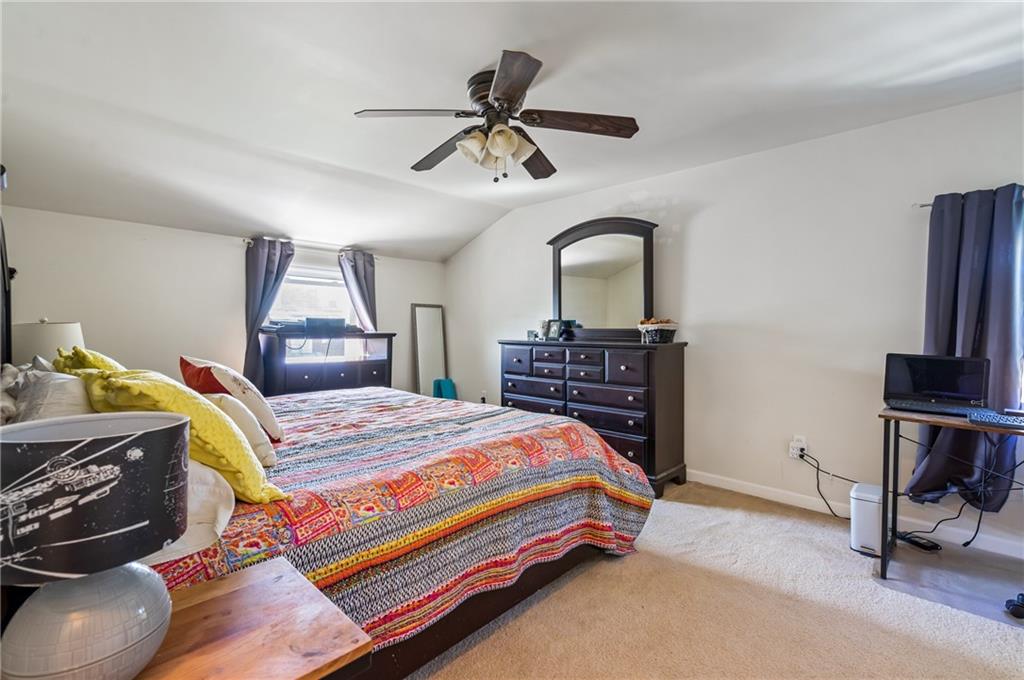 3702 Colby Street Pittsburgh, PA 15214 - Photo 11 of 21 a bedroom with a bed and a chandelier