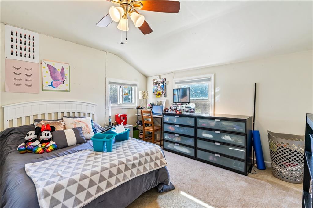 3702 Colby Street Pittsburgh, PA 15214 - Photo 13 of 21 a bedroom with a bed and a chandelier