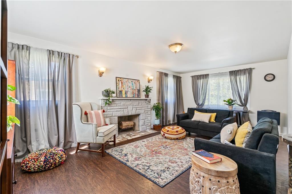 3702 Colby Street Pittsburgh, PA 15214 - Photo 2 of 21 a living room with furniture and a fireplace