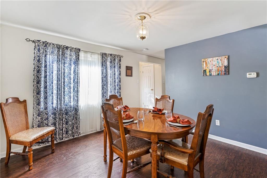 3702 Colby Street Pittsburgh, PA 15214 - Photo 4 of 21 a view of a dining room with furniture and wooden floor