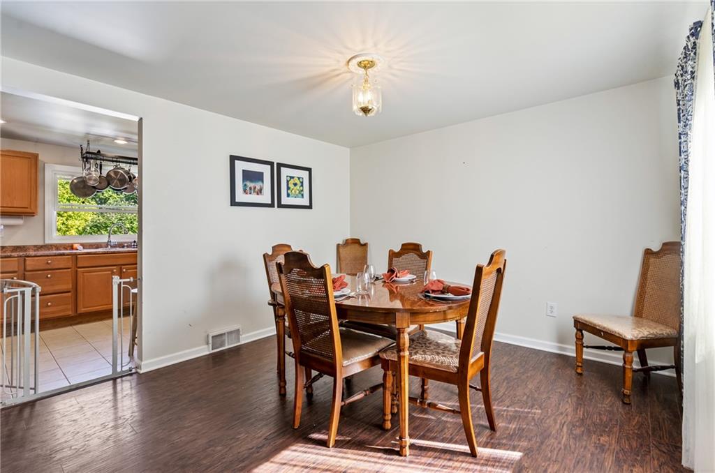 3702 Colby Street Pittsburgh, PA 15214 - Photo 5 of 21 a view of a dining room with furniture and wooden floor