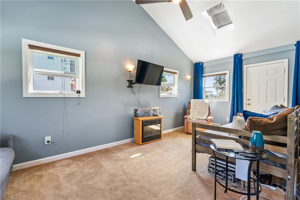 3702 Colby Street Pittsburgh, PA 15214 - Photo 9 of 21 a living room with furniture and a flat screen tv