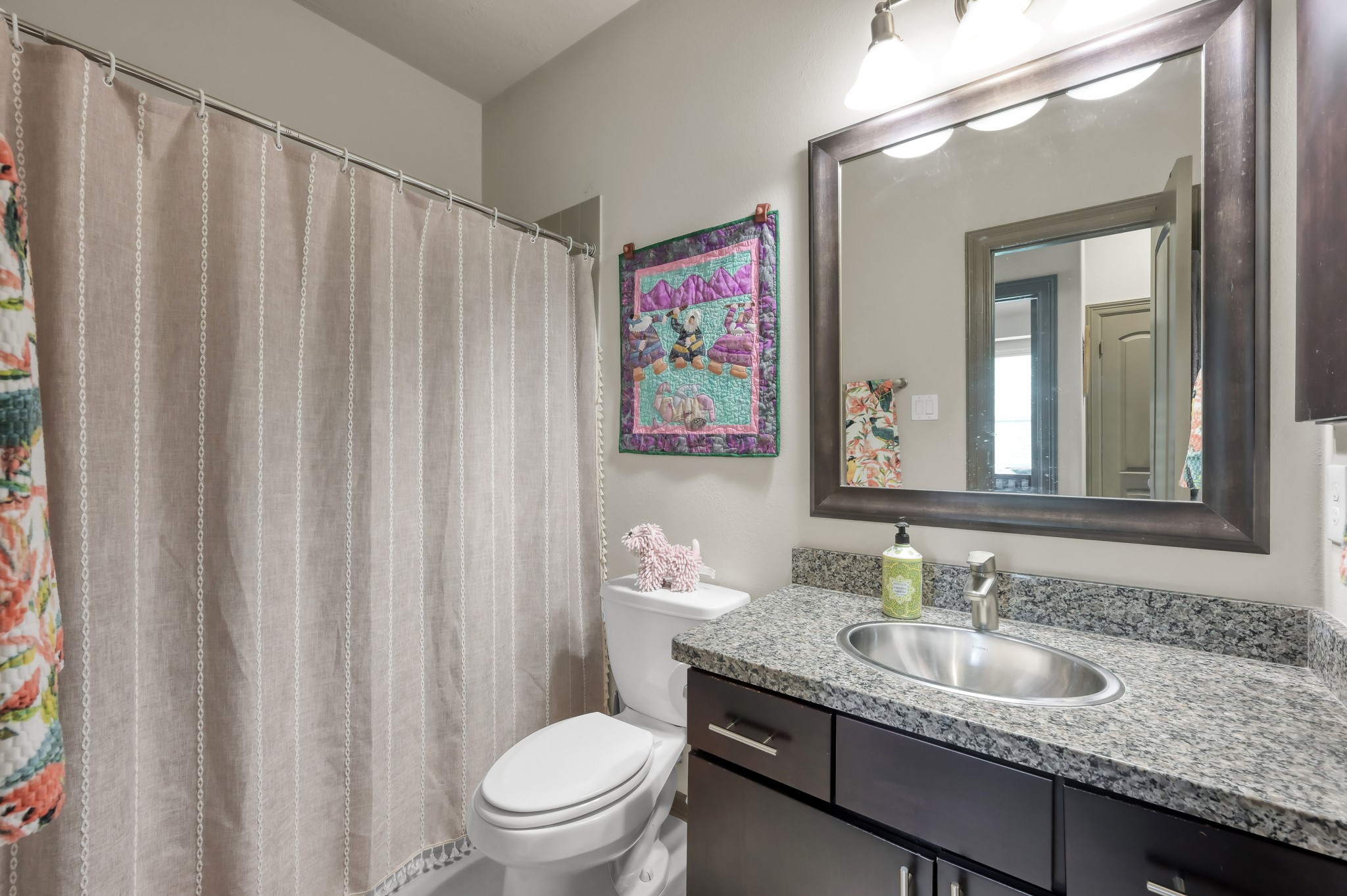 18 Aventura Place Spring, TX 77389 - Photo 30 of 43 a bathroom with a granite countertop sink vanity mirror and toilet