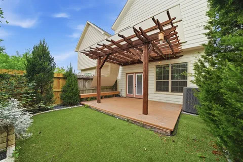 a view of a backyard with a patio