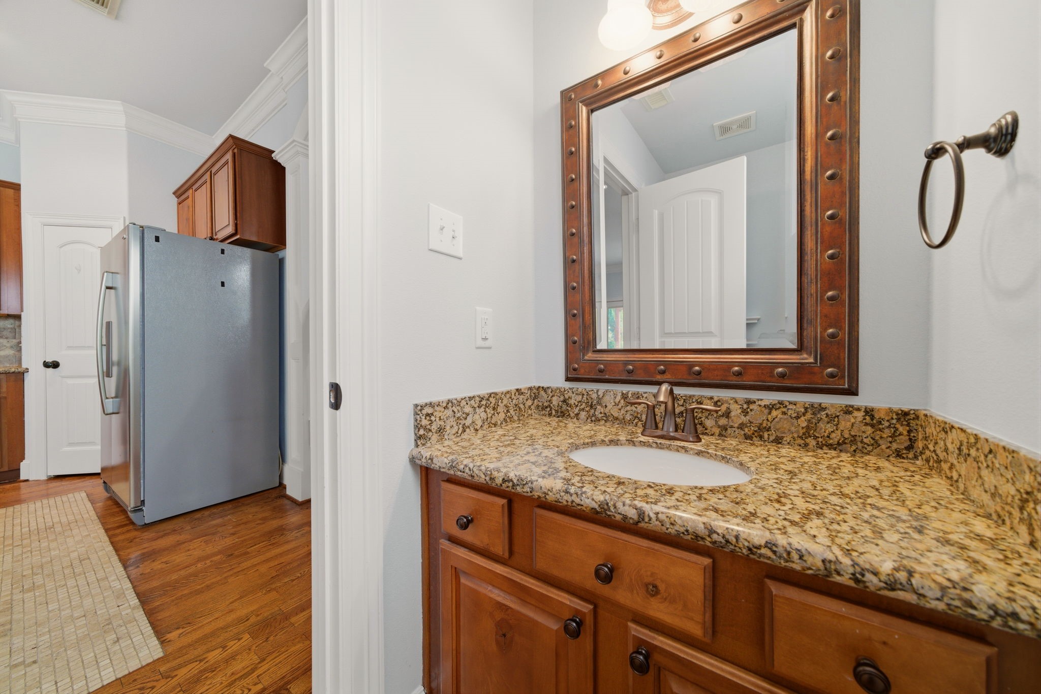 1007 Kern Street Houston, TX 77009 - Photo 12 of 35 a bathroom with a granite countertop sink and a mirror