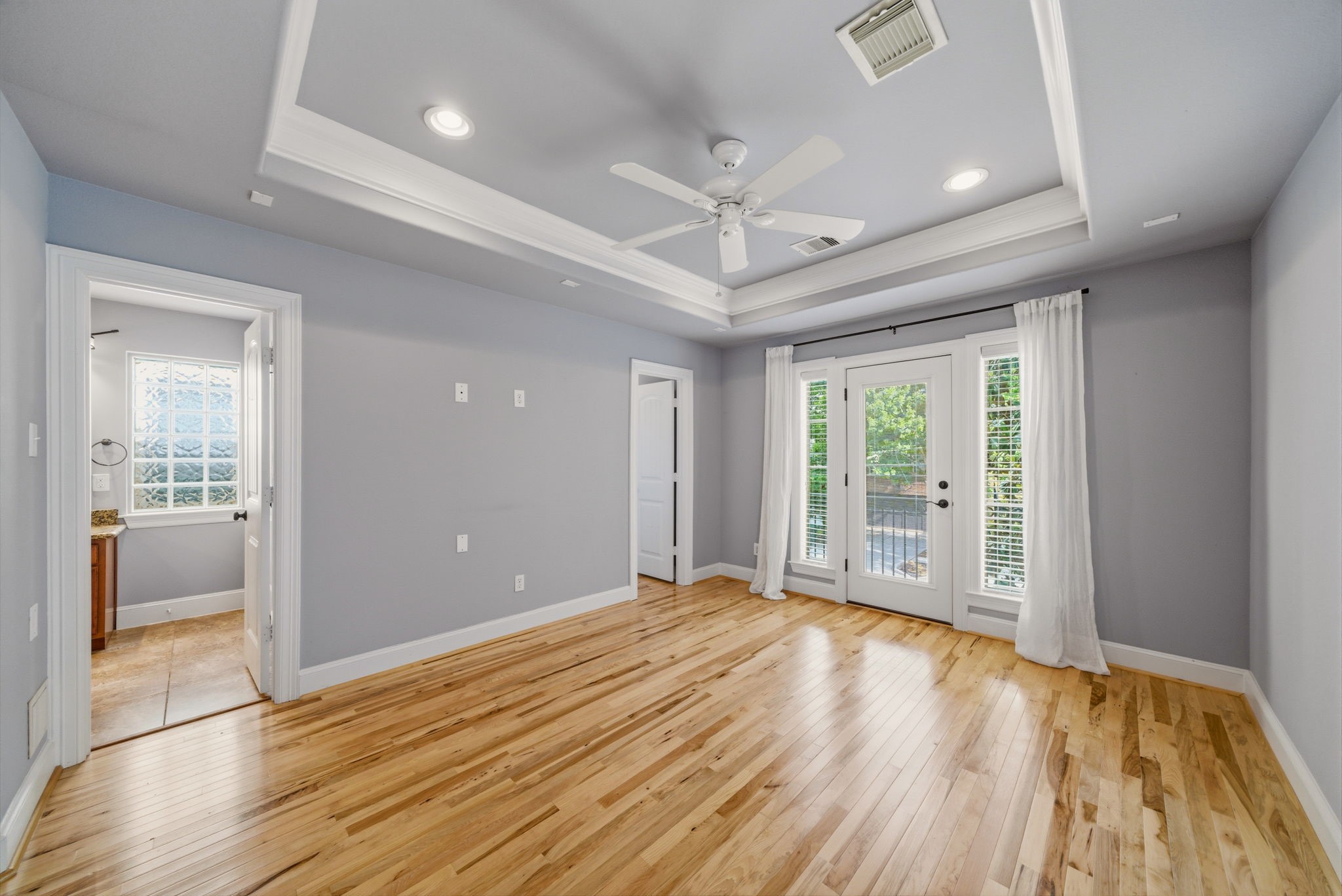 1007 Kern Street Houston, TX 77009 - Photo 13 of 35 a view of an empty room with wooden floor and a window