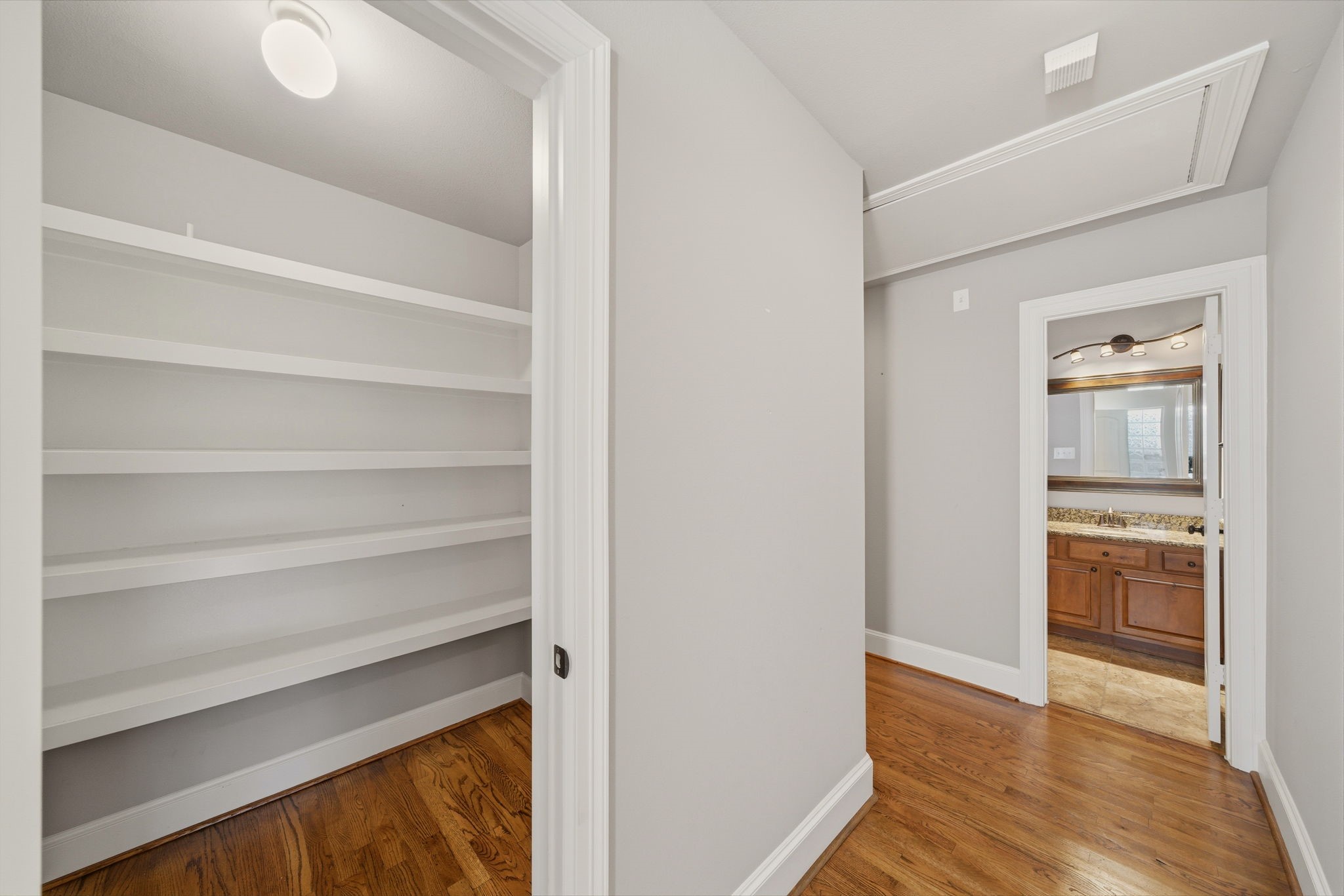 1007 Kern Street Houston, TX 77009 - Photo 19 of 35 a view of walk in closet with empty racks