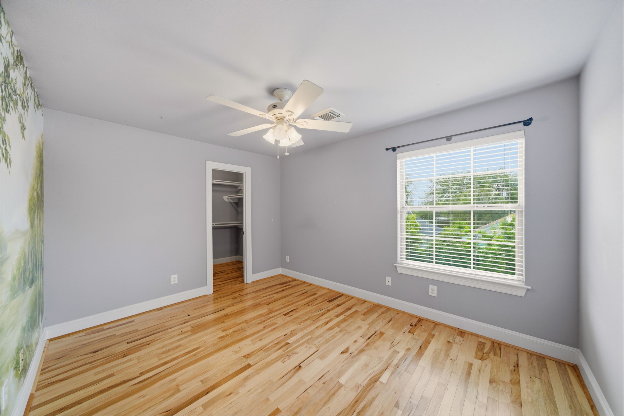 1007 Kern Street Houston, TX 77009 - Photo 22 of 35 a view of an empty room with wooden floor and a window