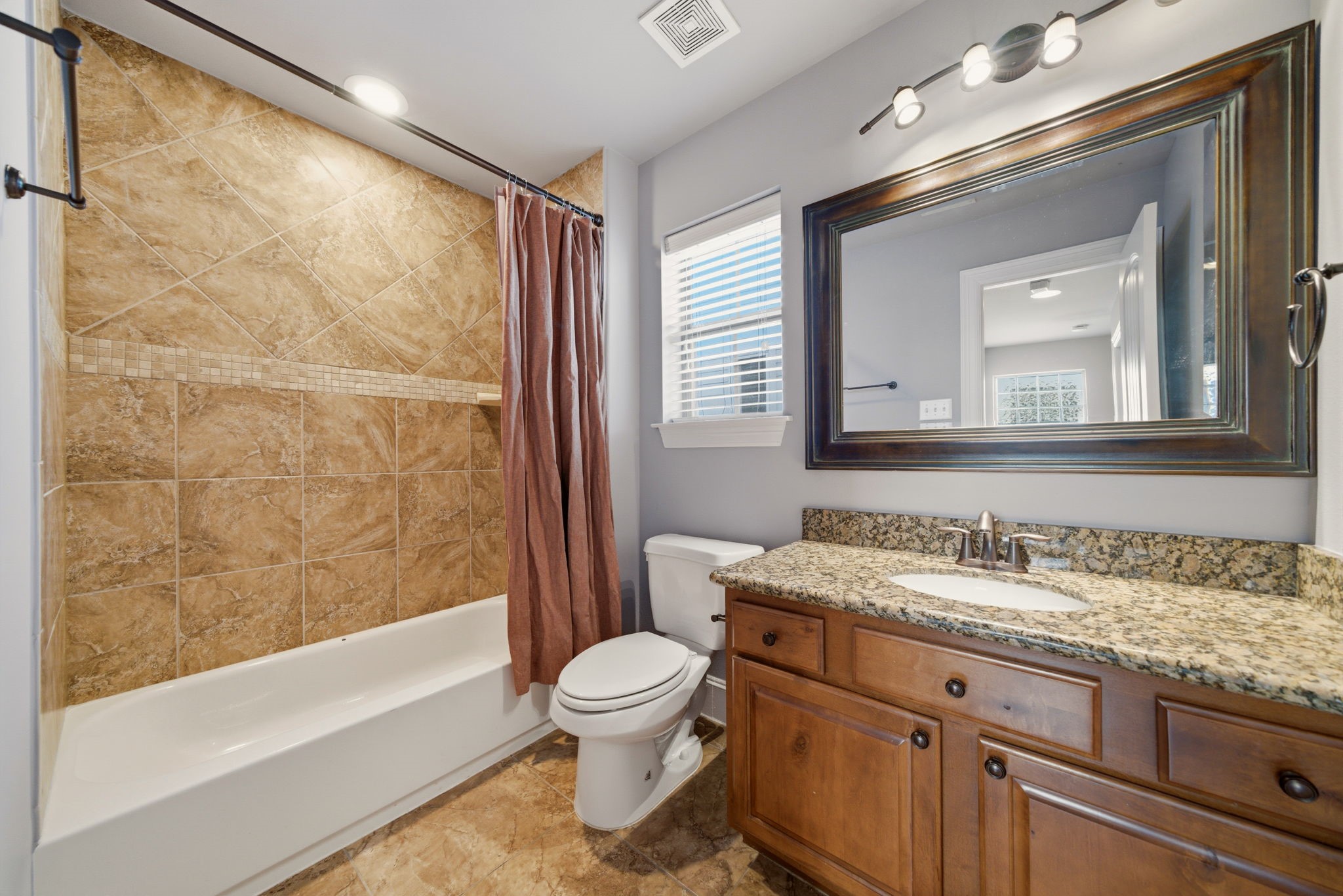 1007 Kern Street Houston, TX 77009 - Photo 24 of 35 a bathroom with a granite countertop sink toilet and shower