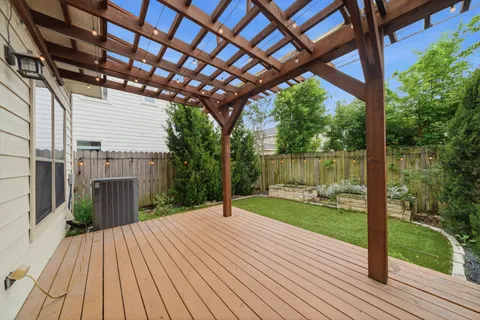 a view of a wooden deck with a yard