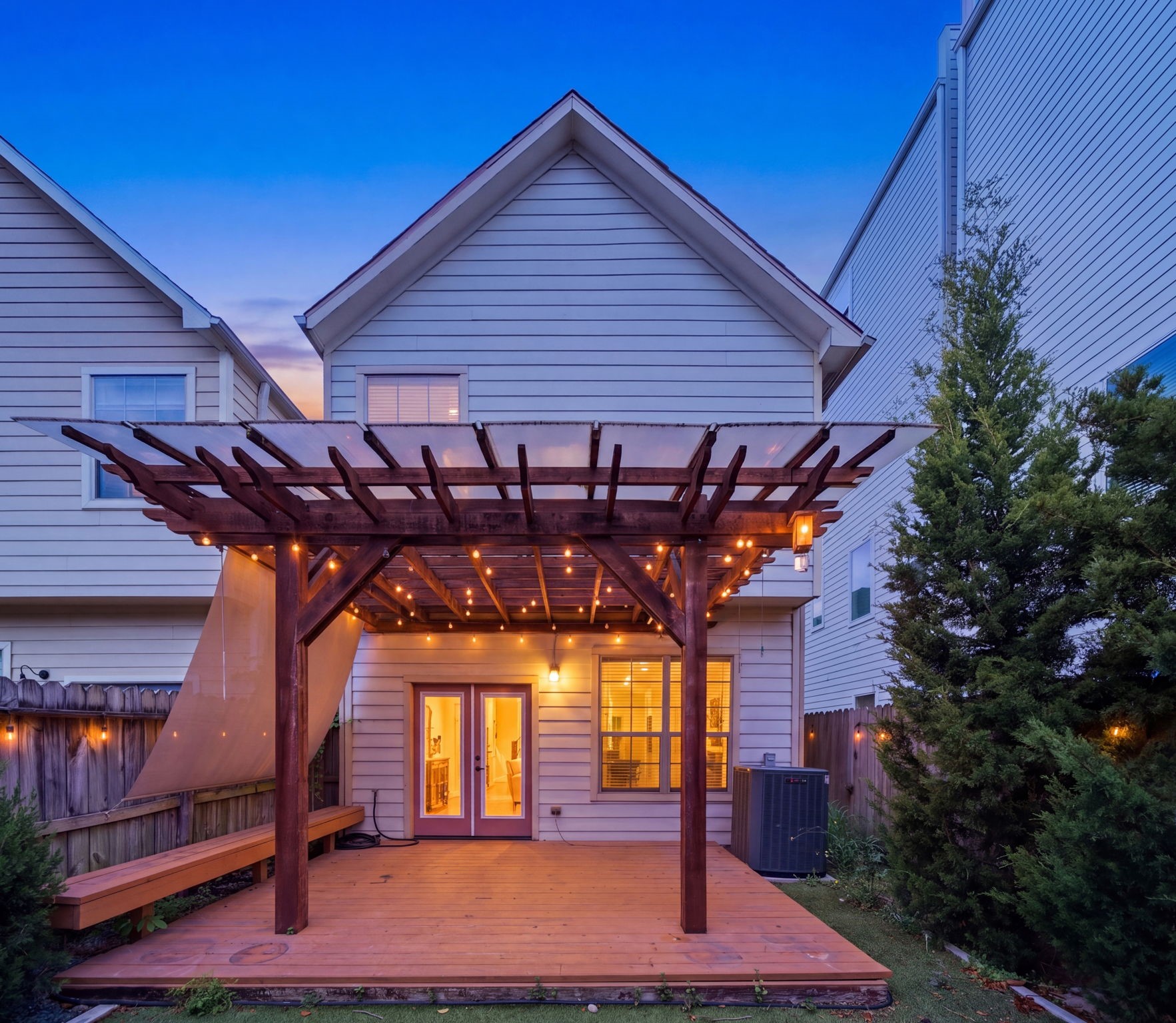 1007 Kern Street Houston, TX 77009 - Photo 4 of 35 a roof deck with table and chairs under wooden roof and potted plants
