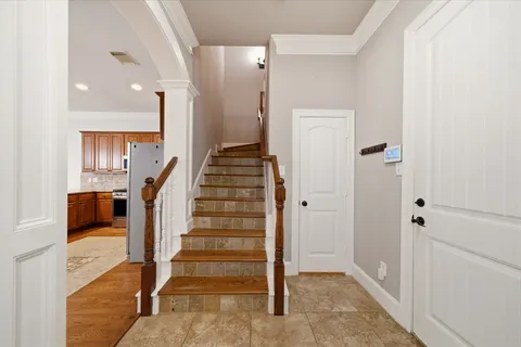 a view of entryway with furniture and wooden floor