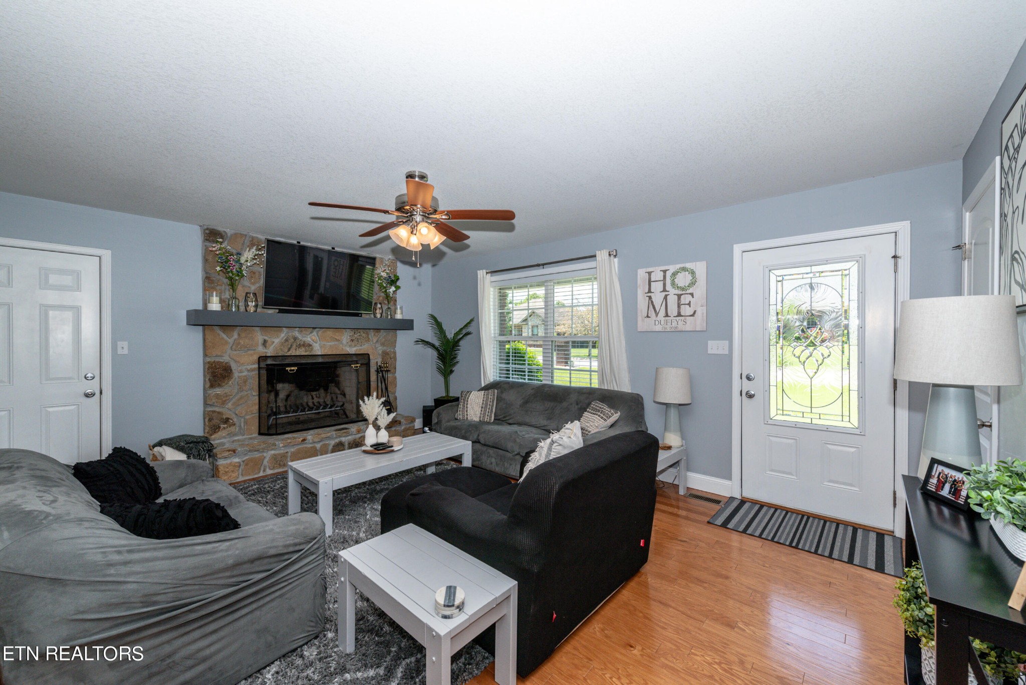 1303 Houston Springs Road Greenback, TN 37742 - Photo 11 of 31 a living room with furniture and a fireplace