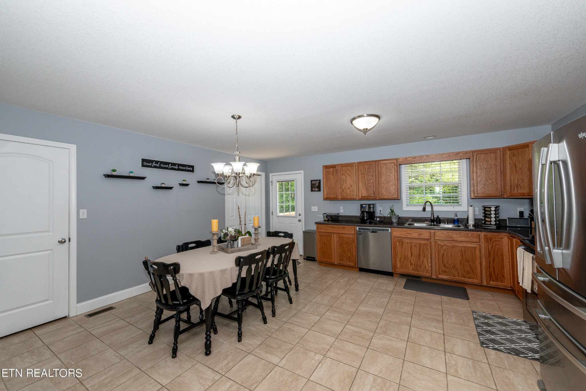 1303 Houston Springs Road Greenback, TN 37742 - Photo 13 of 31 a kitchen with stainless steel appliances kitchen island granite countertop a sink and cabinets