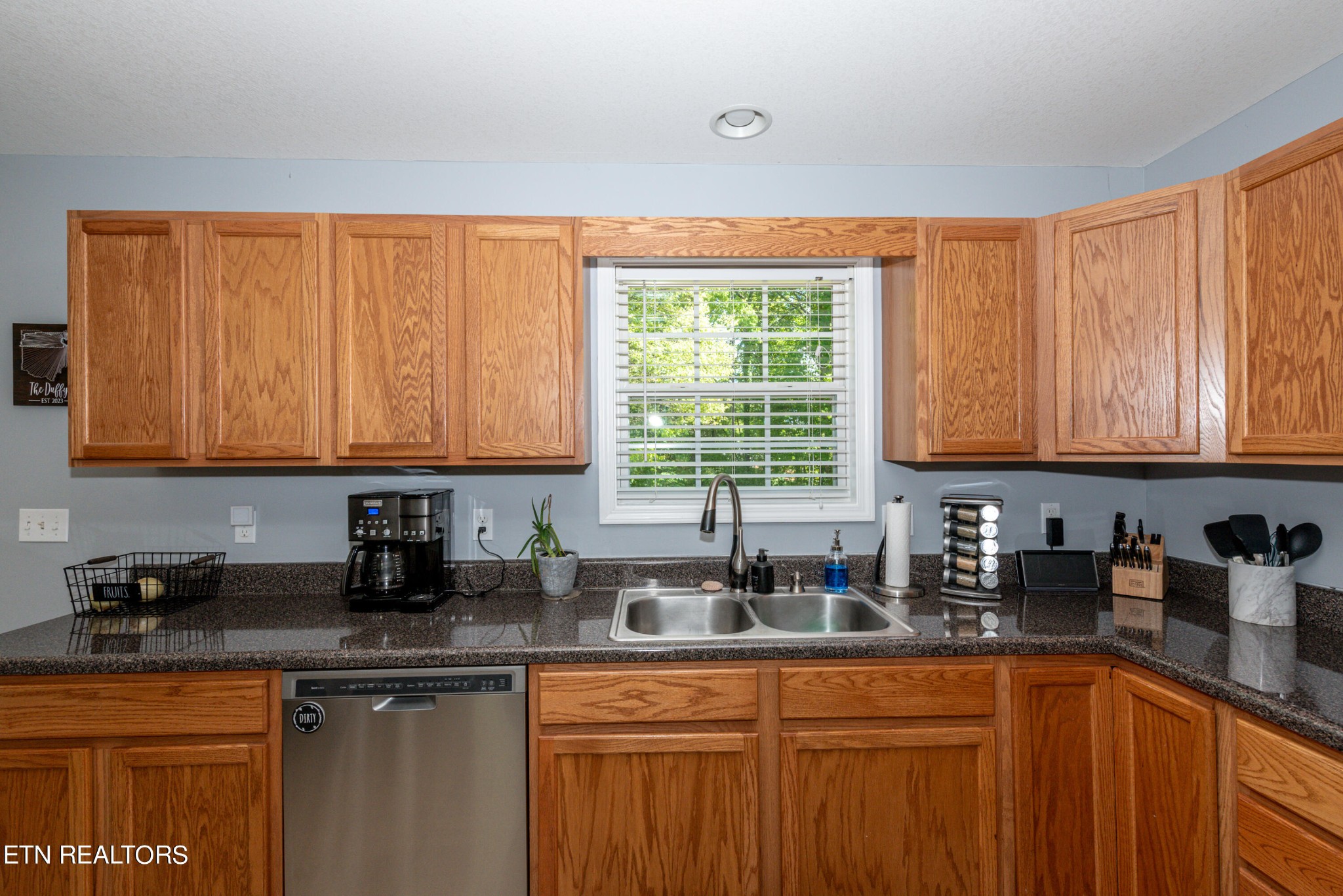 1303 Houston Springs Road Greenback, TN 37742 - Photo 15 of 31 a kitchen with stainless steel appliances granite countertop wooden cabinets a sink and a counter space