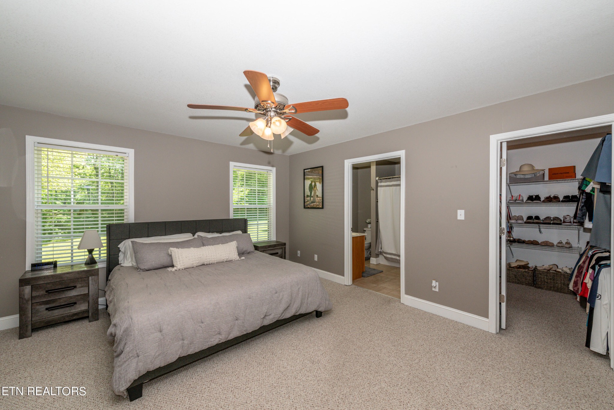 1303 Houston Springs Road Greenback, TN 37742 - Photo 18 of 31 a bedroom with a bed and a chandelier