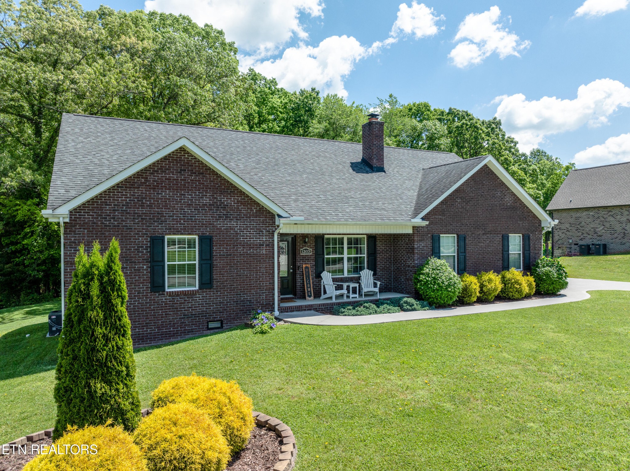 1303 Houston Springs Road Greenback, TN 37742 - Photo 2 of 31 a front view of a house with a yard and garage