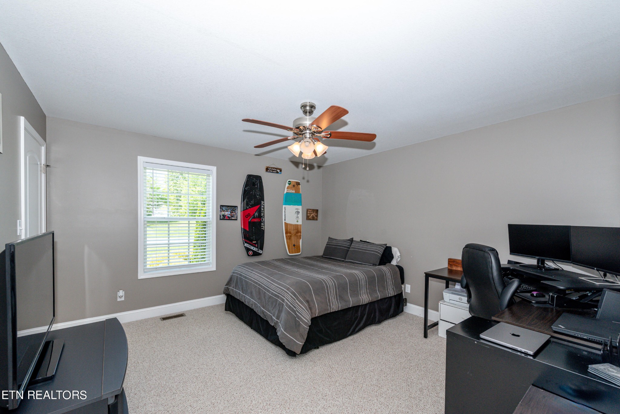 1303 Houston Springs Road Greenback, TN 37742 - Photo 27 of 31 a bedroom with a bed and a flat screen tv
