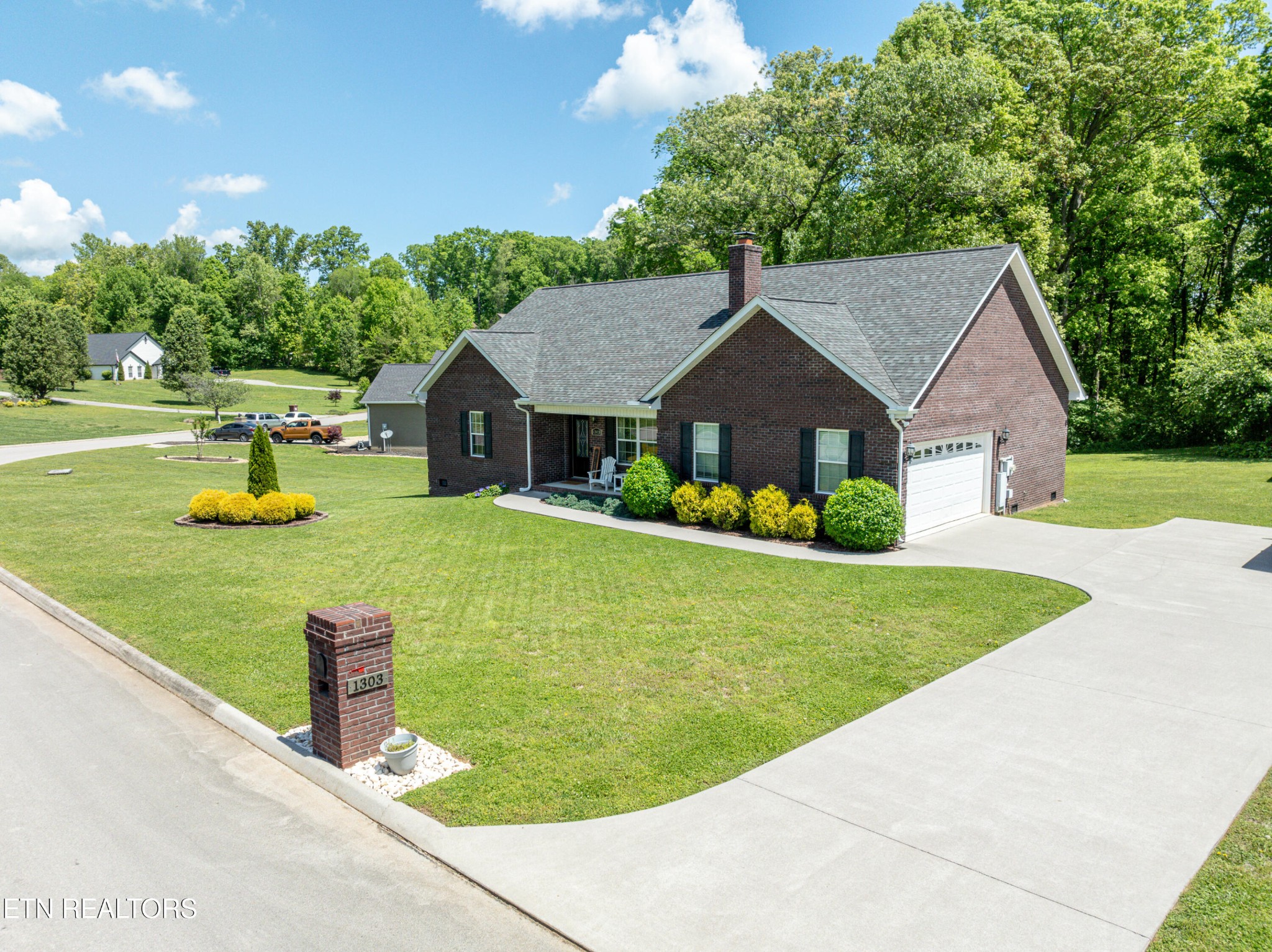 1303 Houston Springs Road Greenback, TN 37742 - Photo 3 of 31 a front view of a house with garden
