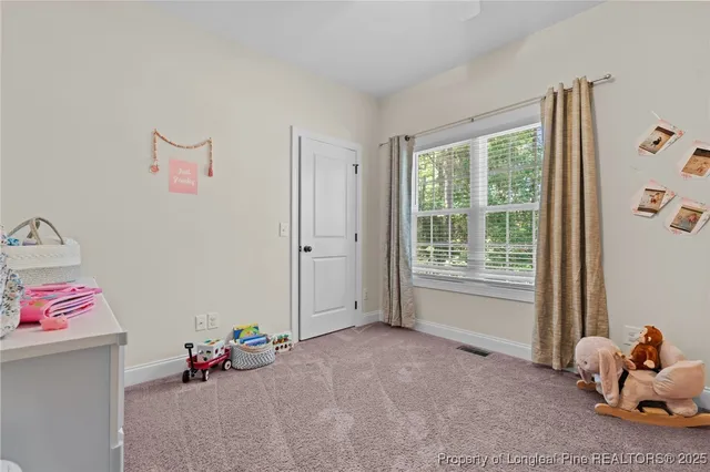 a bathroom with a double vanity sink mirror and toilet