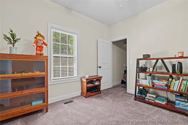 a view of livingroom with furniture and windows