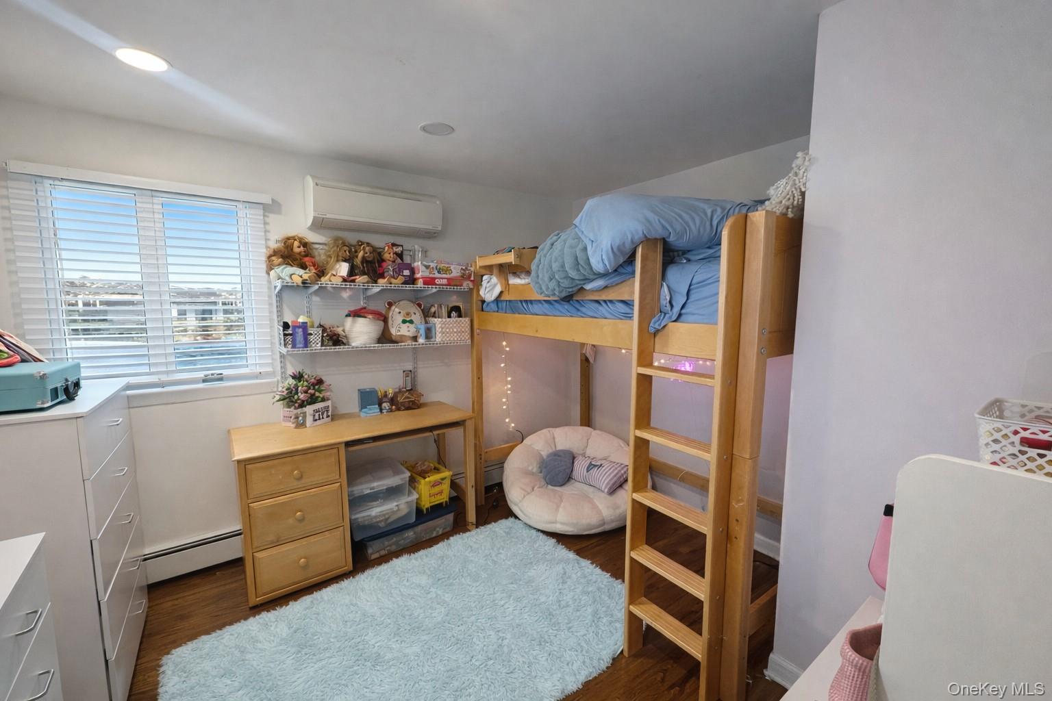 611 W Road Queens, NY 11693 - Photo 5 of 8 a room with a bed and a window