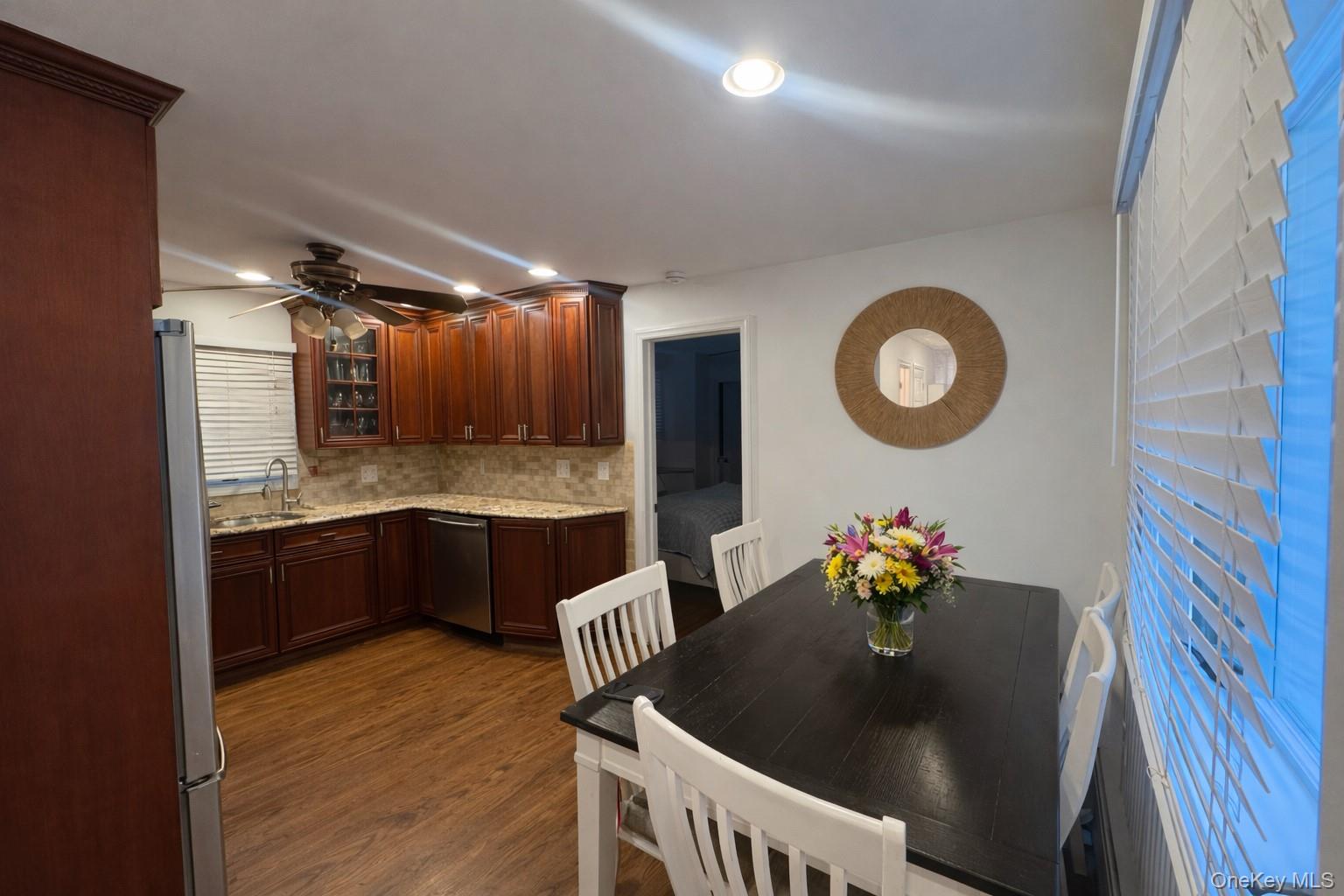 611 W Road Queens, NY 11693 - Photo 7 of 8 a kitchen with granite countertop a sink cabinets and stainless steel appliances