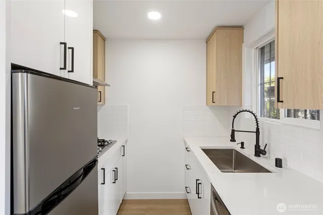 a bathroom with a sink and mirror