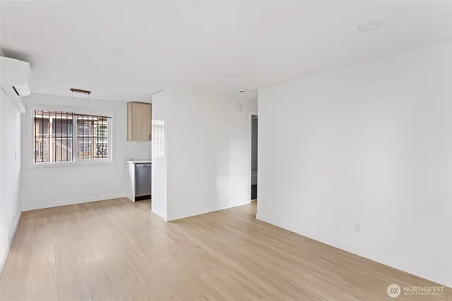 a view of an empty room with a window