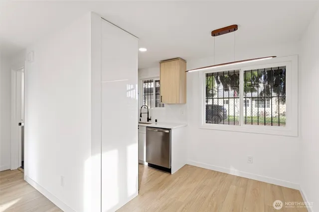 a view of a kitchen from the hallway