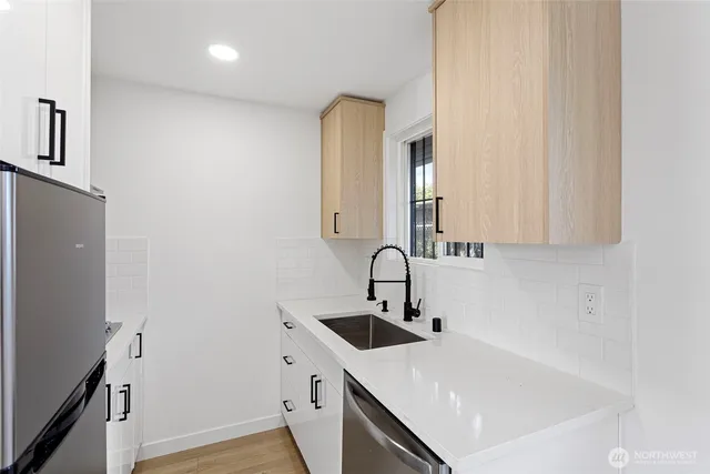 a bathroom with a sink and a bathtub