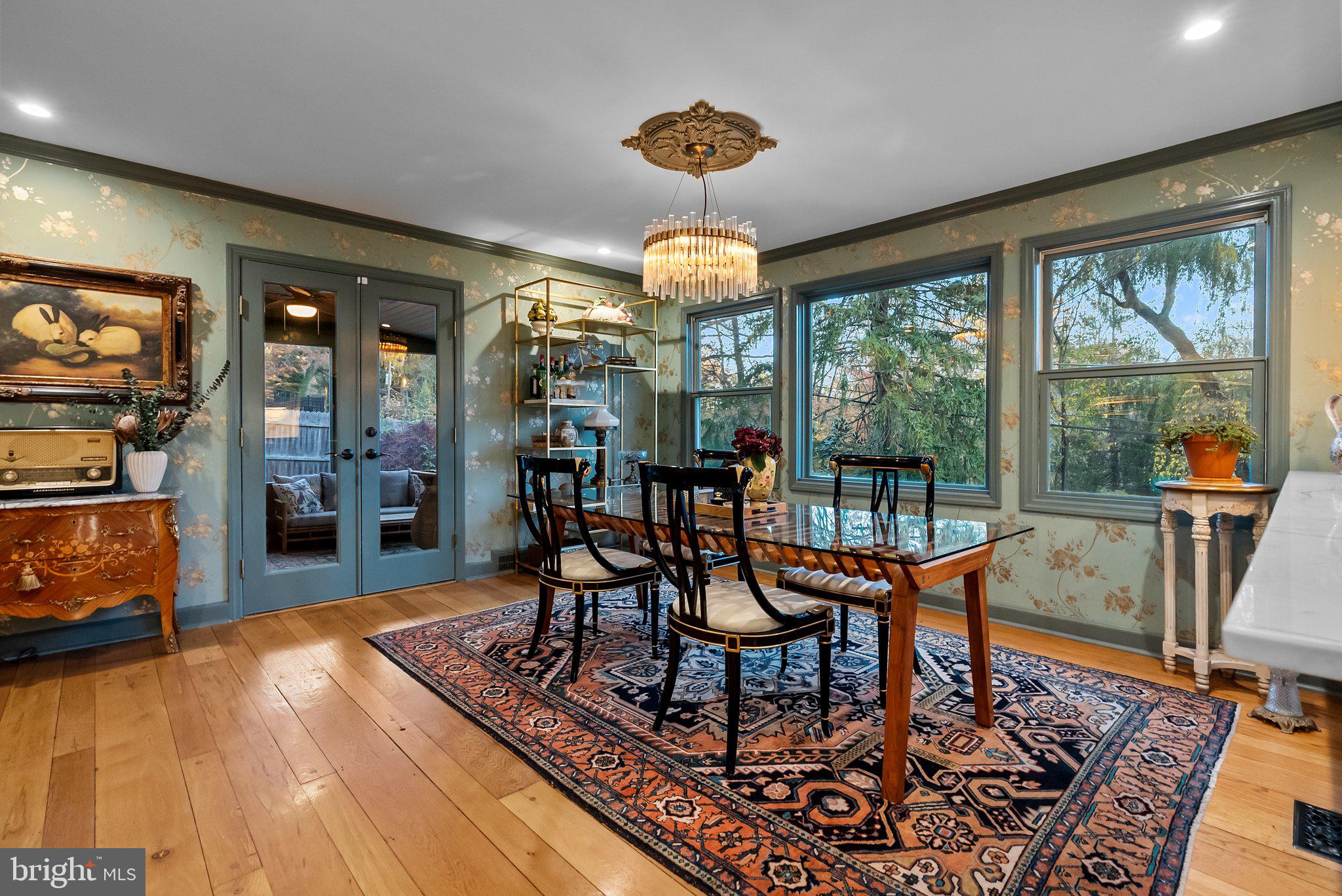 12 Chestnut Lane Wayne, PA 19087 - Photo 25 of 52 a dining room with furniture a chandelier and wooden floor