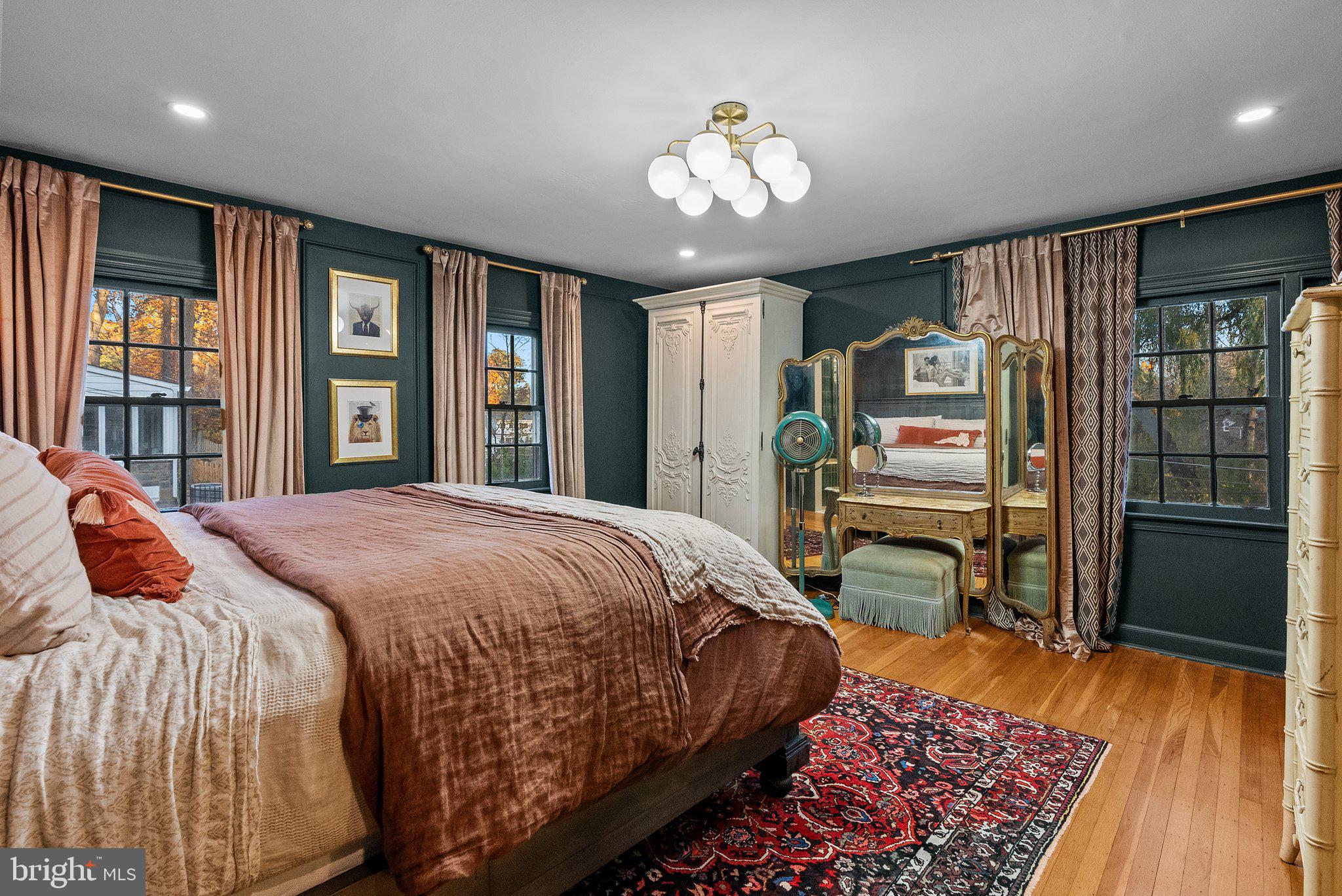 12 Chestnut Lane Wayne, PA 19087 - Photo 30 of 52 a bedroom with a large bed and a chandelier