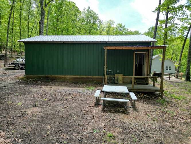 478 Flat Top Road Young Harris, GA 30582 - Photo 24 of 75 a backyard of a house with table and chairs